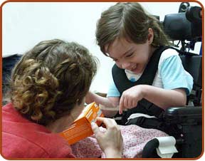 disabled child pointing to cookie box